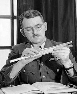 Sir Frank Whittle with a slide rule.