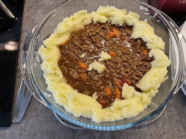 Cottage pie, some mash around the edge.