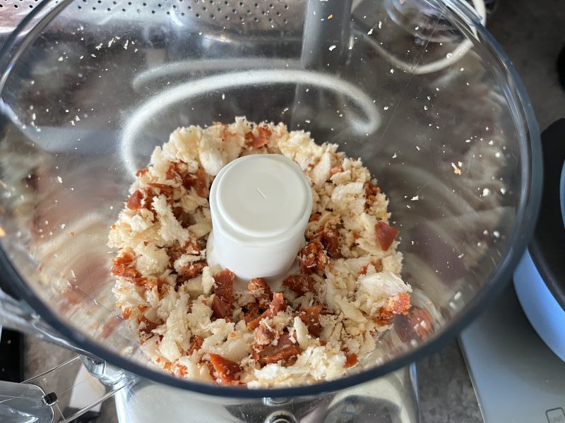 Breadcrumbs and bits of chorizo in a food blender.