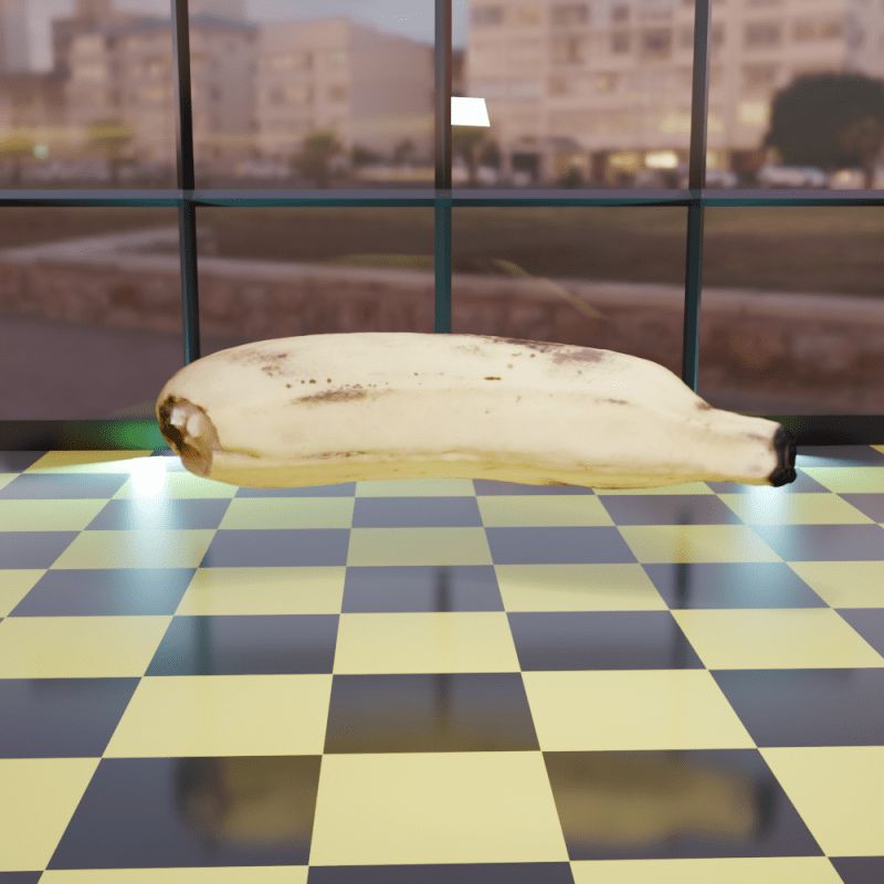 Large banana suspended over a black and yellow checked floor.
